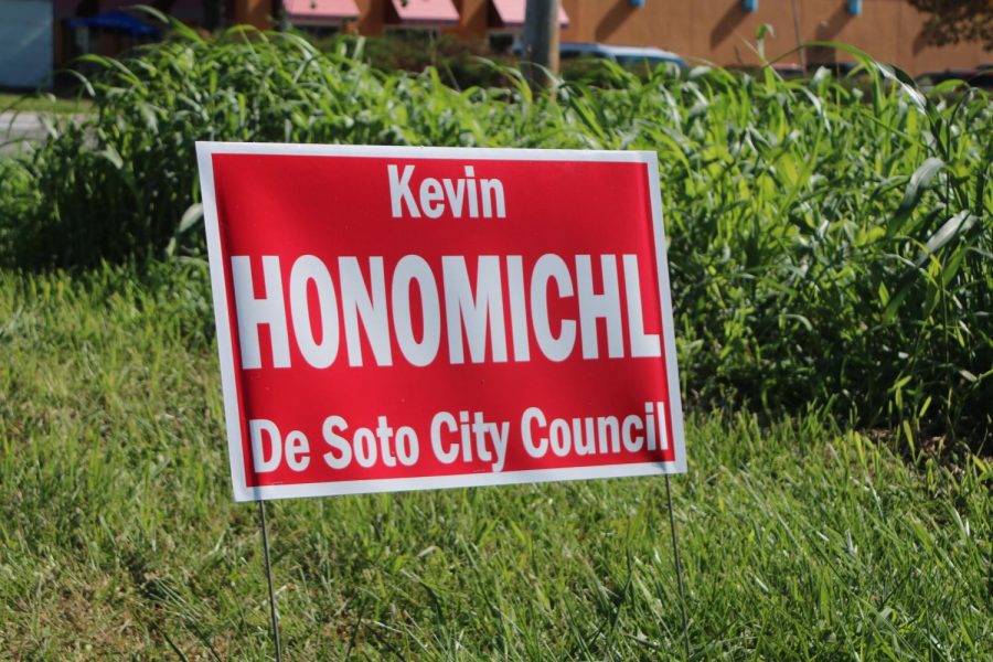 A sign for City Councilman at-large candidate Kevin Honomichl is planted near DHS property. 