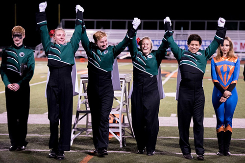 DHS drum majors after being announced grand champions on Oct. 11