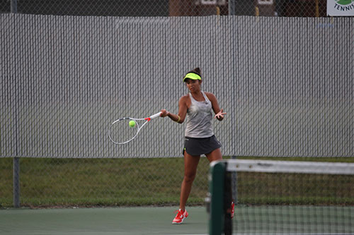 Issa Sullivan forehands the ball during tennis match on Sept. 15