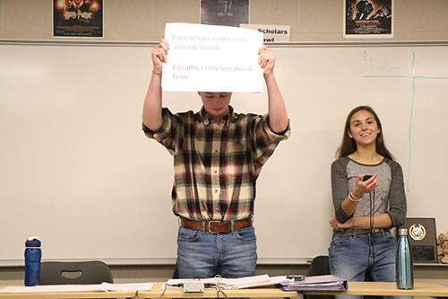 Senior Zach Yarborough holds up a foreign language question at Scholars Bowl practice on Oct. 24. Photo by Johnny Meehan.