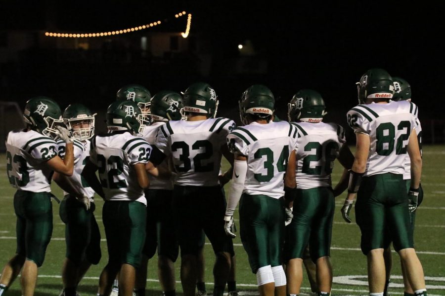 Some of the boys on the DHS football team look out onto the field at their game against Fort Scott on Nov. 10.