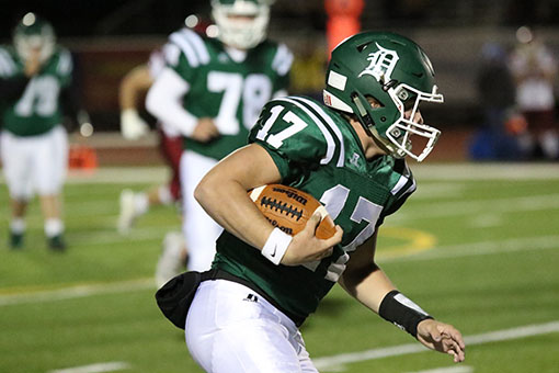 Senior Quarterback Bryce Mohl scrambles against Eudora on Oct. 27, one of his four rushing attempts during the game.