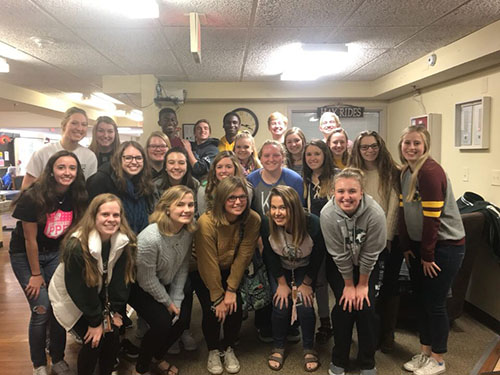 NHS students pose for the camera after a day of bingo at the De Soto Nursing Home on Nov. 18.