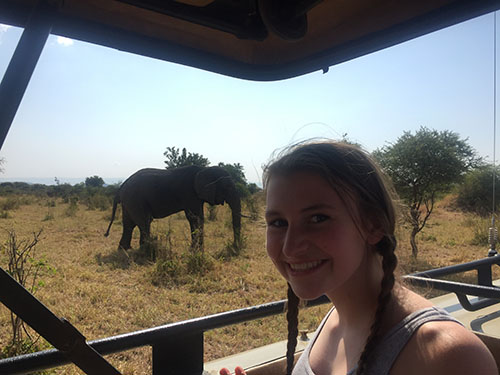 Sophomore Ashlen Boresow poses with an elephant during a safari expedition in Africa.