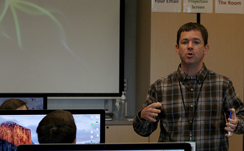 Ben Stamey directs his Web Page Design class in an activity on Dec. 13.