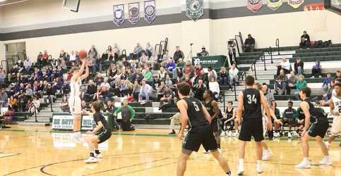 Senior Jared Baruth shoots for a three point basket.