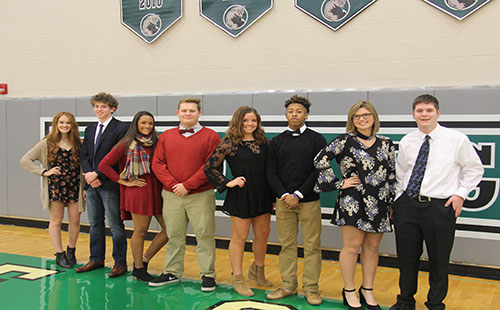 Senior candidates Mackenzie Clark, Jared Baruth, Haley Dalrymple, Kyle P. Bell, Kira Horn, Exavier Jackson, Josie Bedford and Alex Webber pose in the DHS gym. 