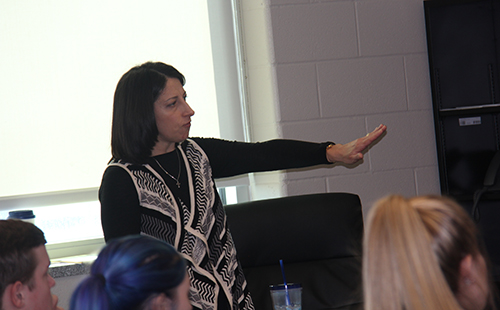 Counselor Crissy Johns explains to a group of De Soto High School students some of the new classes that will be available for the 2017-18 school year on Jan. 24