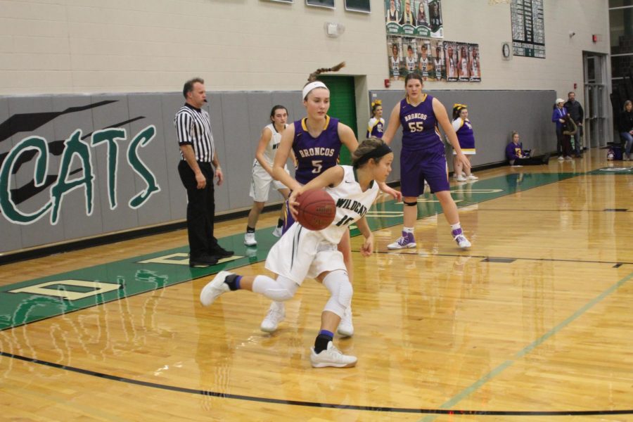 Sophomore Lamyah Ricks runs the ball past the Spring Hill High School defense on Jan. 9.