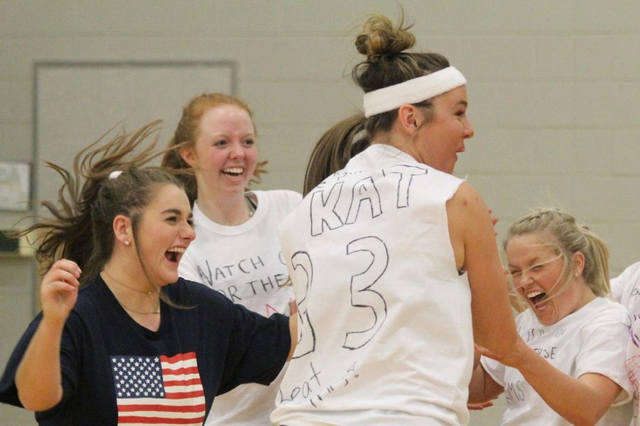 Juniors Ally Barnhart, Kaitlyn Bell and Krista Rush and senior Alexa Rosetta, members of "Watch Out for These Arms," celebrate a victory in the quarterfinals of the tournament on Jan. 12.