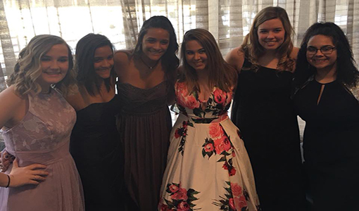 Models junior Lizzy Arnold, seniors Kenize and Haley Dalrymple, junior Caroline Whipple and seniors Payton Faddis and Mireya Edwards Nino pose after the show.