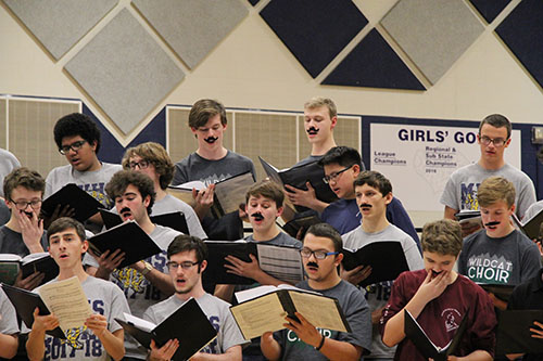 Students perform with fake mustaches at the USD 232 Tenor/Bass Festival on Jan 8. Photo by Rylee Wilson.  