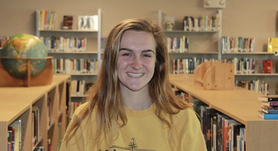 Junior Rylie McDaniel poses in the library on March 9. 