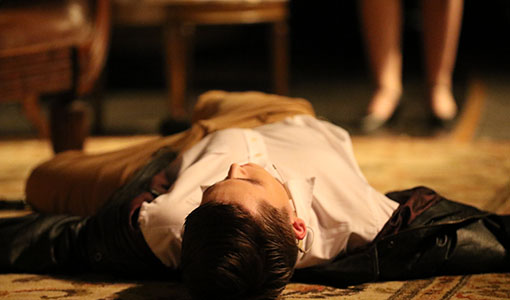 Zac Matthew, as Philip Lombard, lies dead from a revolver fired by Emma Leonard, as Vera Claythorne, during the climax of the performance of "And Then There Were None" on Thursday, March 1.