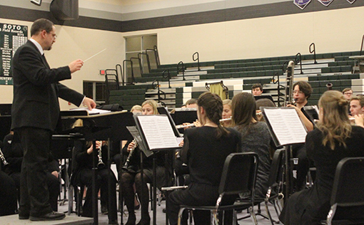  De Soto High School band director Matt Bradford conducts the DHS band at their winter concert on Feb. 12. The DHS band is headed to Washington D.C. for its bi-annual band trip. 
