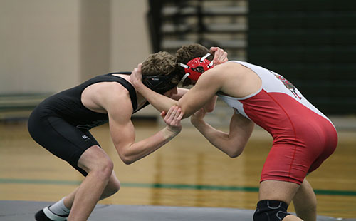 Sophomore Luke Barger takes on a member from Hiland Park High School at the DHS meet on Jan 24.