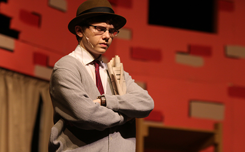 Junior Connor Young plays an irritated Mr. Mushnik in the De Soto High School spring musical Little Shop of Horrors. 