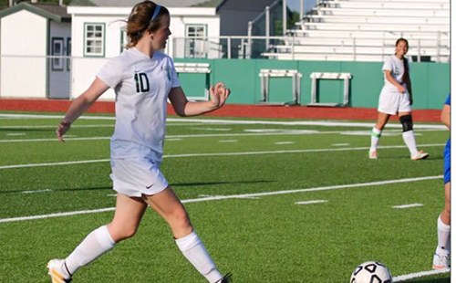 Senior defender Alex Schemmel dribbles the ball up the field at a home game during the 2017 season.
