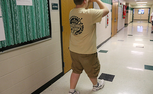 Sophomore Connor Cravens practices his roll steps in preparation for the Masonic Marching Band on May 22.