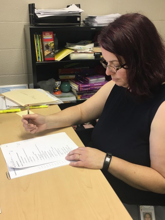 Spanish teacher Carolyn Rodriguez grades papers during her final days here at DHS. 