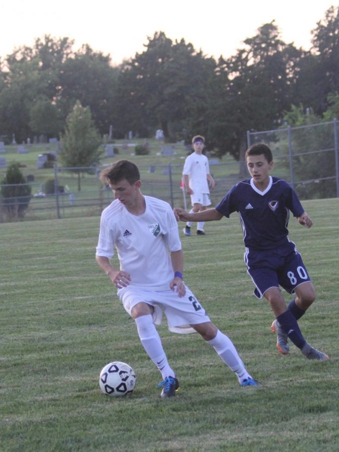 Senior Carson Brier dribbles the ball at a home game in 2017. 