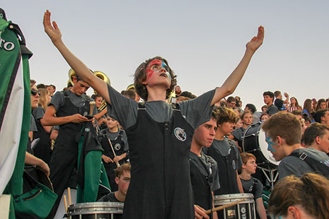 Sophomore Connor McCall celebrates in the band section at a football game during the 2018 season.