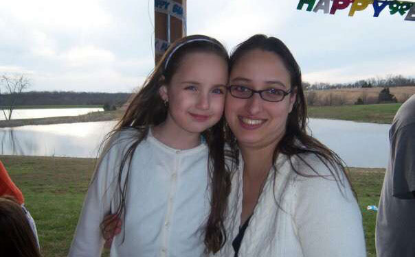 Maggie Diaz smiles with her mother in 2008 at a childhood birthday party.