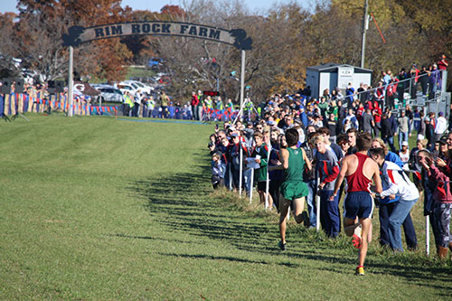 The boys run into the finish line as they conclude their race.