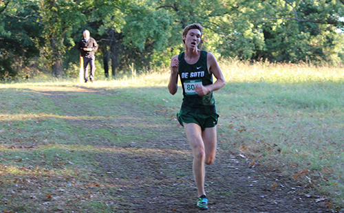 Senior Aydan VanMeerhaeghe leads the pack during the boys' JV race at the UKC meet at Wyandotte County Park on Oct. 11.  