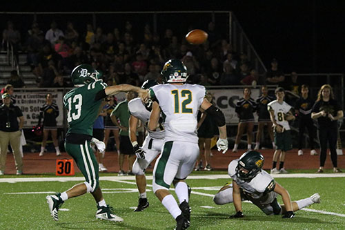 Sophomore Jackson Miller attempts a pass in the game on Oct. 5 against Basehor-Linwood. 