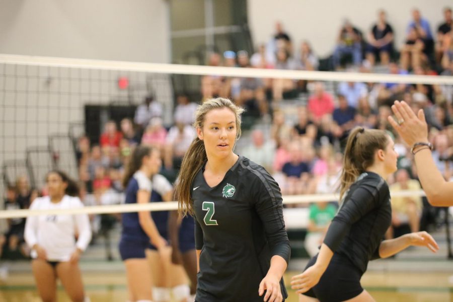 Kaitlyn Bell walks away from the net after the DHS varsity team scores on Mill Valley.