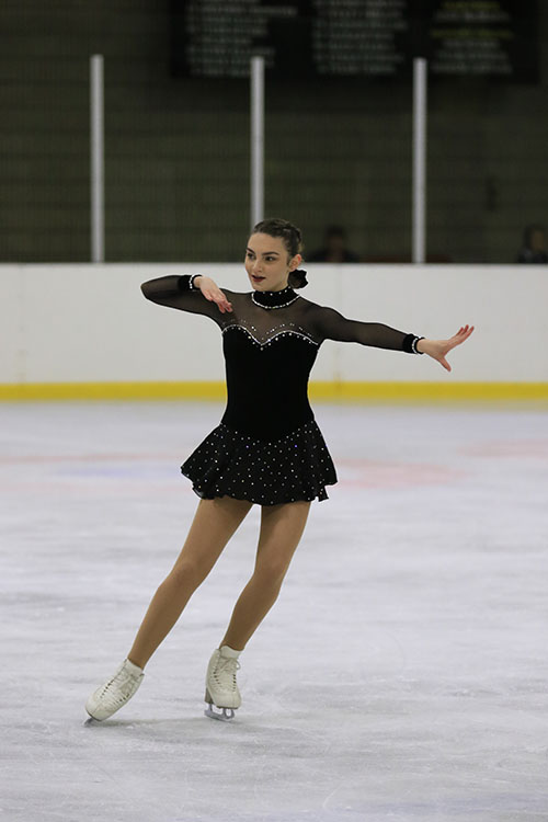 Sophomore Rylie Chambers poses during a figure skating competition held at the Kansas City Ice Center in Shawnee on Sept. 21.
