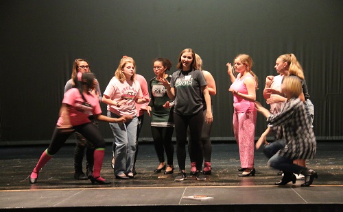 Junior Claire Kennard leads one of her choreographed dances in Guys and Dolls at practice on Oct. 5. 
