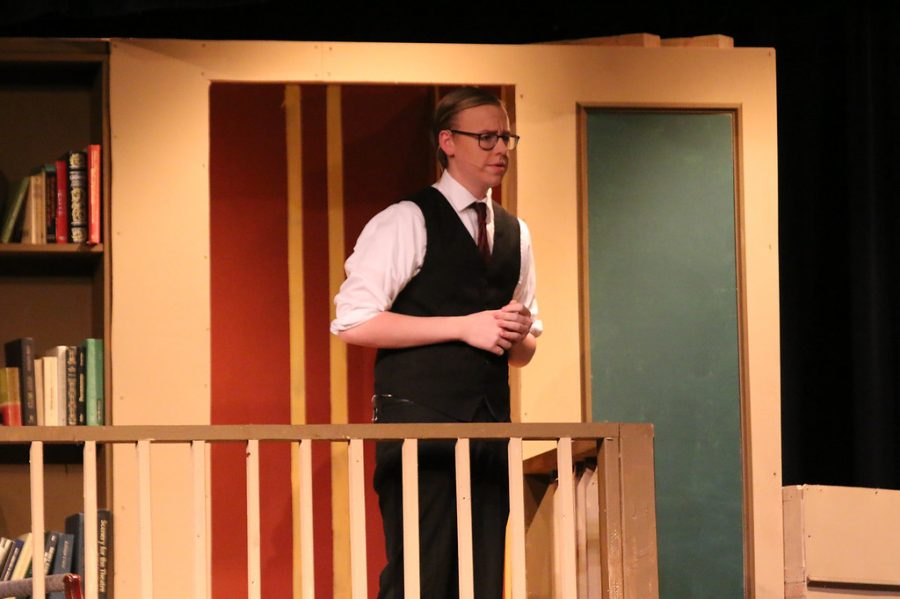 Senior Trace Harre plays Rogers, the butler, in the play And Then There Were None on March 1, 2018.