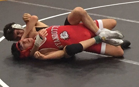 Senior Josh Padron dominates his opponent during the De Soto Duals Wrestling Tournament on Jan. 18, 2019