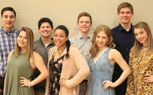 Senior Winter Homecoming Candidates Caroline Whipple,  Linnea Searls, Olivia Mills, Shantel Horne, Tyler Barkemeyer, Daniel Smith, Joseph Schnieders and Grant Noll pose for a picture on Jan. 24.