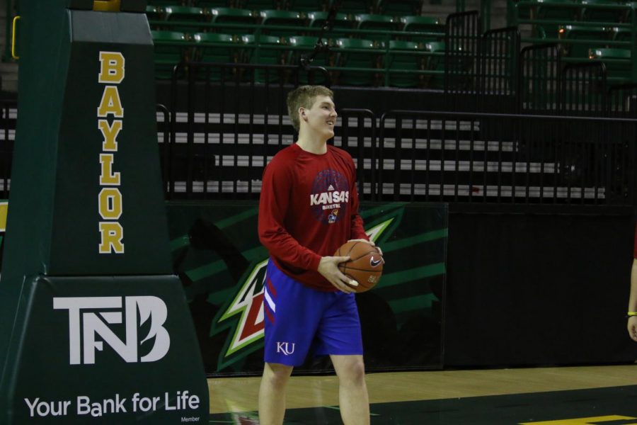 De Soto High School alumnus Noah Wilson helps out with warm-ups before the KU women's basketball game at Baylor in Waco, Texas,  on Feb. 20. 