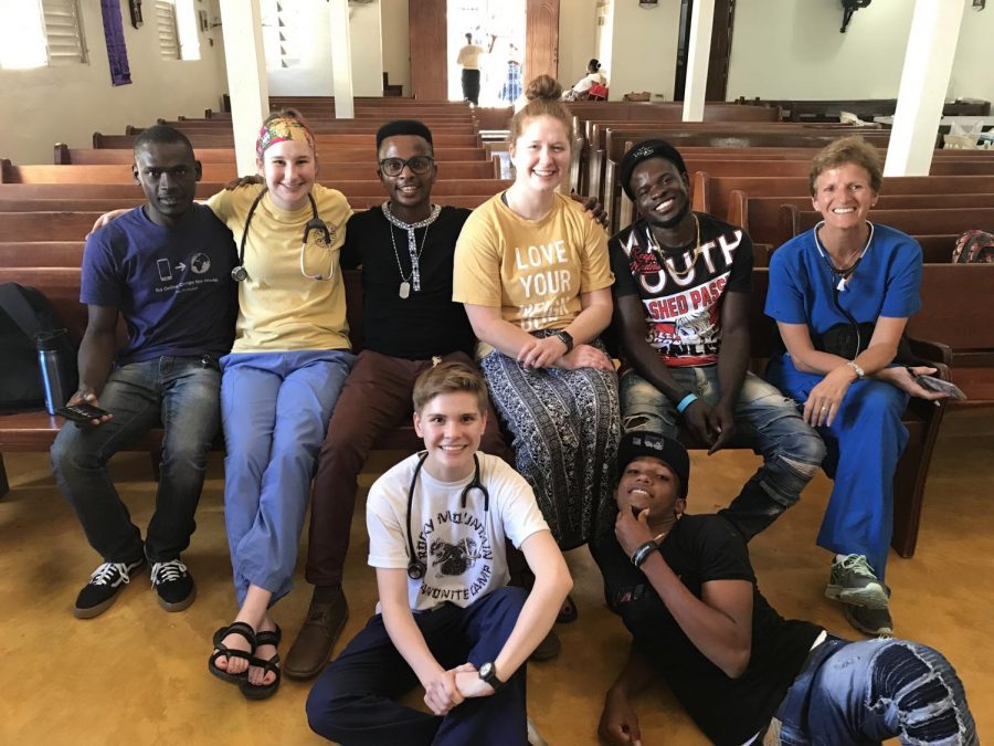 Jose, Maggie, Anderson, Emma, Alex, Dr. Julie, and Wilson pose after a long day of seeing patients.