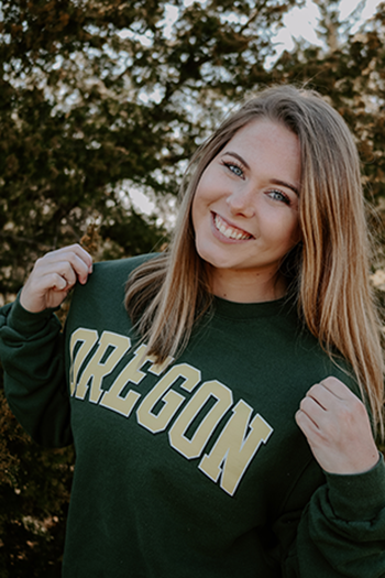 Senior Caroline Whipple sports her University of Oregon sweatshirt after deciding on the school.