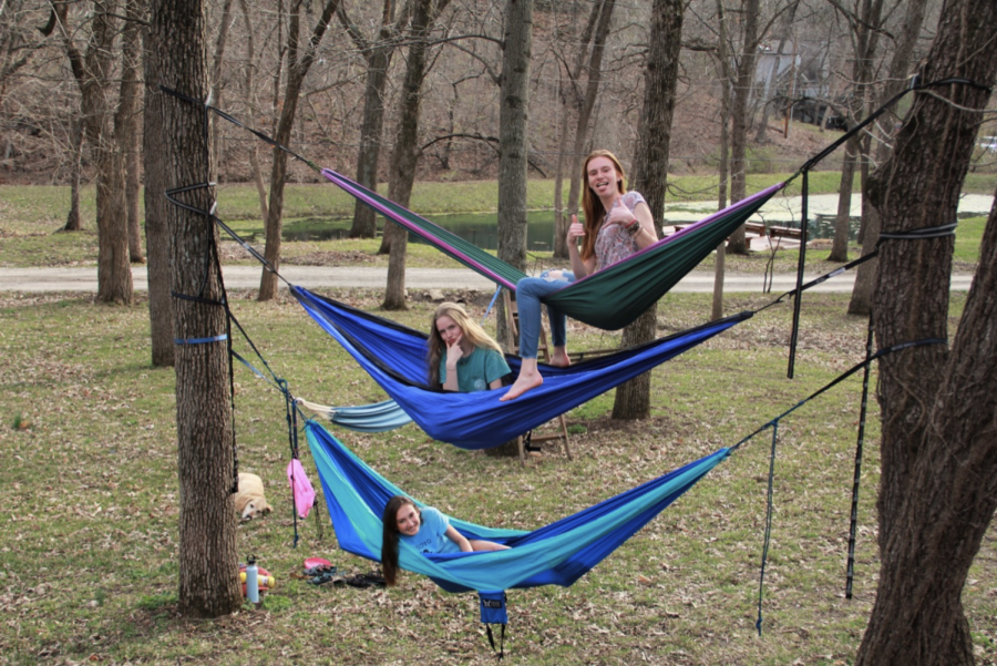 Juniors Lane Hileman, Justine Wheeler, and Erin Pickert hammock on April 7.