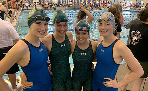 Sophomore Nicole Schottler, freshman Josephine Butler and sophomores Lynlee Hutchison and Liz Schottler pose for a picture after competing in the 200-meter relay at the State competition on May 18. 
