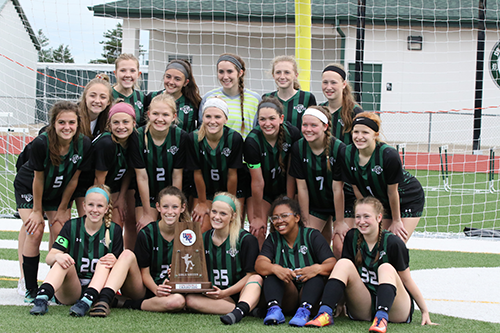 The DHS Varsity girls’ soccer team celebrates winning the UKC title on May 7, 2019. 