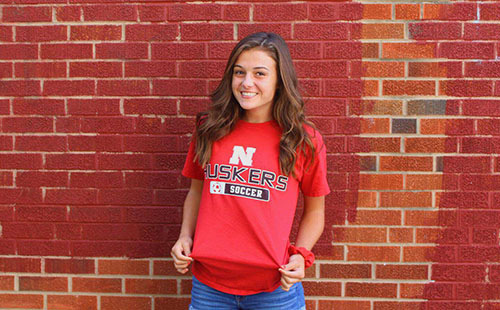 Junior Jordan Zade poses with her University of Nebraska-Lincoln gear on the day of her commitment on Aug 18. 
