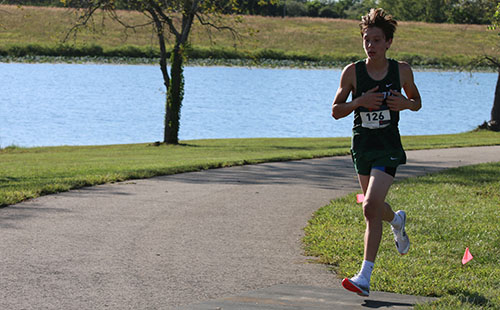 Freshman Landen Lawson races during De Soto High School home meet at Lexington Lake Park on Sept. 13.  