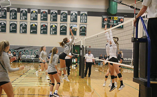 Freshman Erin Barr approaches for a kill at the match versus Louisburg on Sept 5.