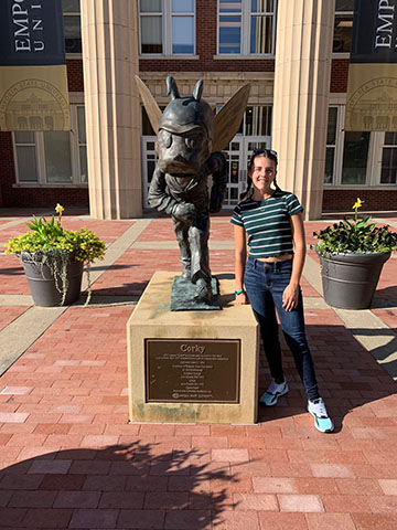 Senior Lily Rodriguez poses next to the Emporia State mascot while on a college visit this September.