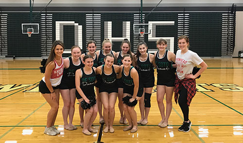 Members of the Diamonds dance team take a picture with the Kansas City Chief's cheerleaders ,after their choreography session.