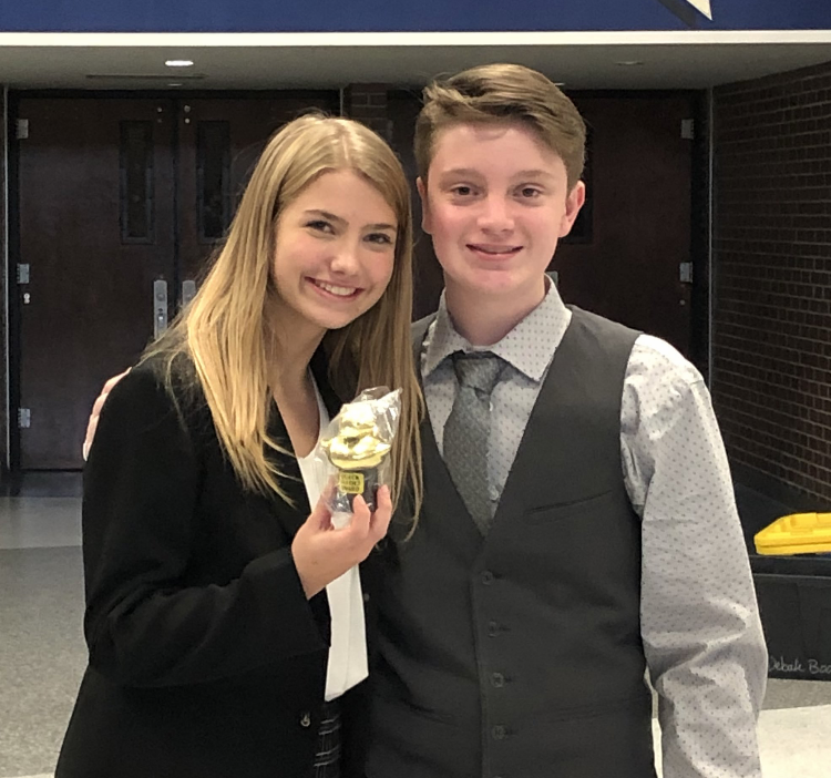 Freshmen Lydia Crest and mason Scott pose with their sixth place trophy at Olathe South High School. 