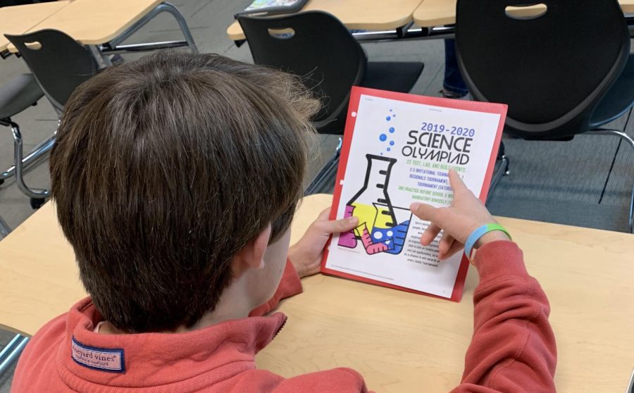 Junior Brent Smith reviews Science Olympiad packet on Oct. 3. 