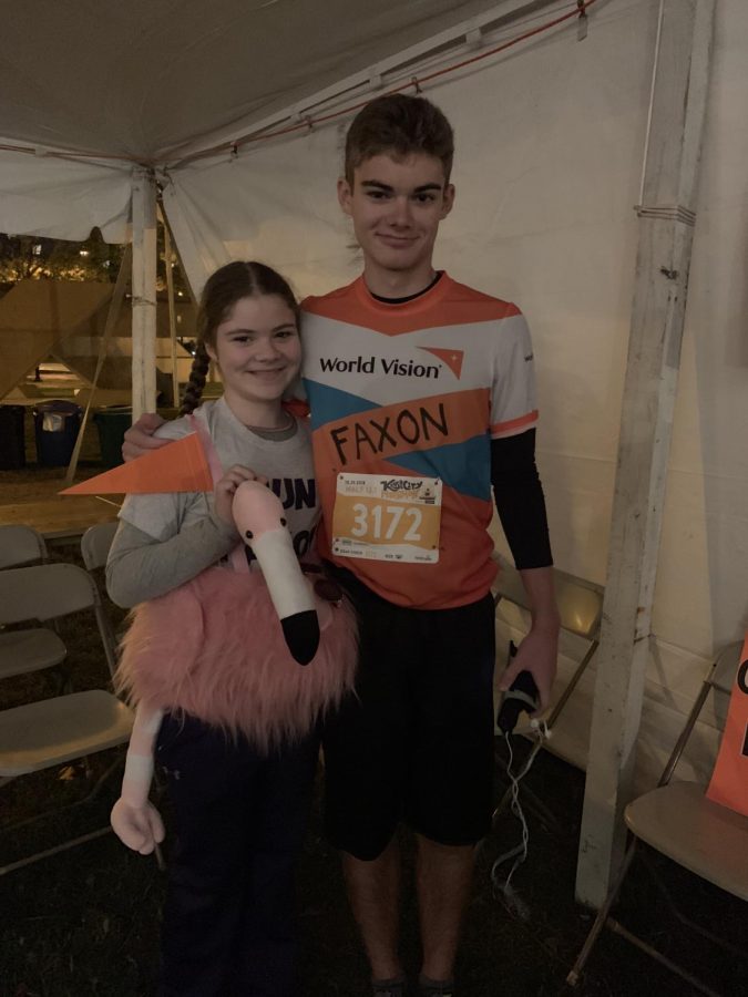 Junior Faxon Freeman stands with his sister, Lexington Trails eight grader Ailey Freeman, after completing a race. 